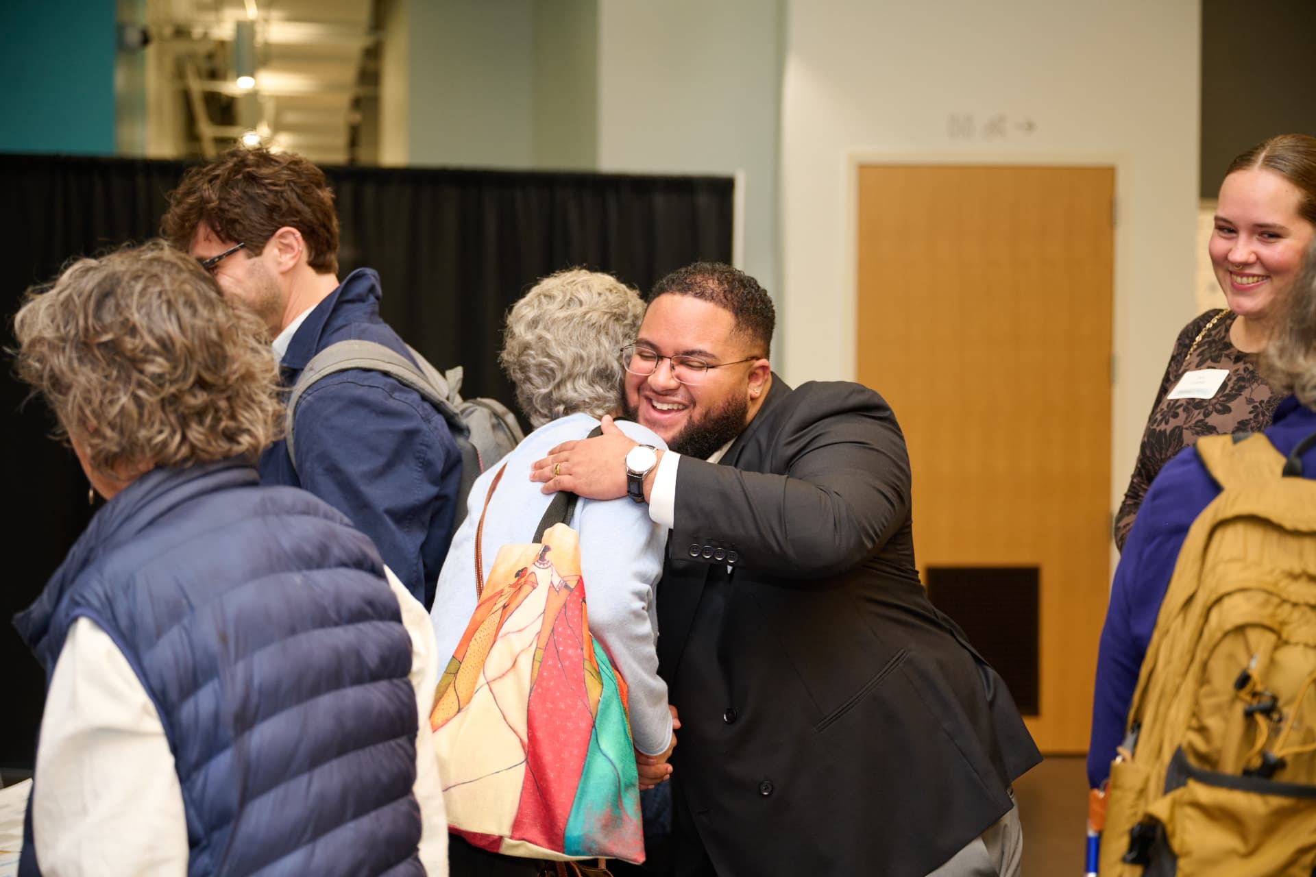 Two Showcase guests greeting each other warmly